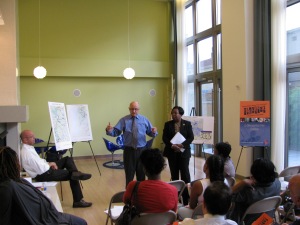 HFTC Director of Policy and Planning Richard Flintrop and Executive Director Dr. Jacquelyn Henry discussed their report at Highland Park apartment's community space.